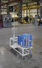 Used Nordson Problue 10 Hot Melt Adhesive Applicator System. Volume 10 liter, melt rate per hour 24 pound, throughput per hour 27.3 pound. Mounted on painted carbon steel frame with casters. Serial# ...